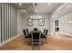 Contemporary dining room with sleek decor, modern lighting, and seating for six guests at 4091 Oak Forest Ne Dr, Brookhaven, GA 30319