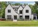 Beautiful two story home with black trim and a manicured lawn at 4091 Oak Forest Ne Dr, Brookhaven, GA 30319