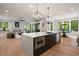 Open concept kitchen featuring a large island, sleek appliances, and seamless flow to living spaces at 4091 Oak Forest Ne Dr, Brookhaven, GA 30319