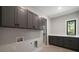 Well-equipped laundry room with lots of cabinets and counter space at 4091 Oak Forest Ne Dr, Brookhaven, GA 30319