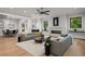 Open concept living room with connecting dining room and wet bar at 4091 Oak Forest Ne Dr, Brookhaven, GA 30319