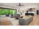 Open-concept living room featuring hardwood floors and a smooth transition to outdoor deck space at 4091 Oak Forest Ne Dr, Brookhaven, GA 30319