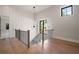 Staircase with black railing and hardwood floors with lots of natural light at 4091 Oak Forest Ne Dr, Brookhaven, GA 30319