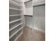 Walk-in closet featuring custom shelves and ample storage space at 4091 Oak Forest Ne Dr, Brookhaven, GA 30319