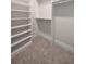 Walk-in closet with built-in shelving and ample storage space at 4091 Oak Forest Ne Dr, Brookhaven, GA 30319