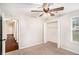 Neutral bedroom features carpet floors, a window, and a closet at 110 Peach Pointe Dr, Mcdonough, GA 30253
