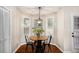Bright breakfast nook featuring a round table and a view of the outdoors through the large windows at 110 Peach Pointe Dr, Mcdonough, GA 30253