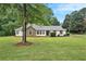 Charming single-story home with a stone facade and well-manicured front yard at 110 Peach Pointe Dr, Mcdonough, GA 30253
