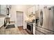Modern kitchen with stainless steel appliances, granite countertops, and stylish cabinetry at 110 Peach Pointe Dr, Mcdonough, GA 30253