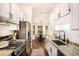 Eat-in kitchen features stainless appliances and ample counter space perfect for cooking and entertaining at 110 Peach Pointe Dr, Mcdonough, GA 30253