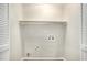 A bright laundry room provides ample space for your appliances at 110 Peach Pointe Dr, Mcdonough, GA 30253