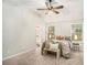 Bright main bedroom features a ceiling fan, carpet floors, and access to a bathroom at 110 Peach Pointe Dr, Mcdonough, GA 30253