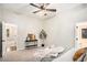 Bright main bedroom features a ceiling fan, carpet floors, and an ensuite bathroom at 110 Peach Pointe Dr, Mcdonough, GA 30253