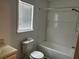 Well-lit bathroom with a clean design, featuring a shower-tub combination and essential fixtures at 226 Walnut Nw St, Atlanta, GA 30314
