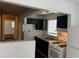 Compact kitchen featuring black cabinetry, white appliances, and a functional layout. Easy to prepare delicious meals at 226 Walnut Nw St, Atlanta, GA 30314