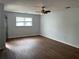 Bright living room features hardwood floors, neutral paint, natural light and ample space. Ready for your decor at 226 Walnut Nw St, Atlanta, GA 30314