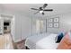 Bright bedroom features a ceiling fan, hardwood floors and ensuite bathroom access at 3176 Gablewood Ct, Decatur, GA 30033