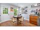 Bright eat-in kitchen with wood floors, natural light and access to outdoor area at 3176 Gablewood Ct, Decatur, GA 30033