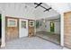 Open garage with shingle and frame construction, wood pile, and green door at 3176 Gablewood Ct, Decatur, GA 30033