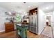 Bright kitchen featuring stainless steel appliances, hardwood floors, and a custom island at 3176 Gablewood Ct, Decatur, GA 30033