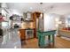 Charming kitchen featuring stainless steel appliances, custom island, and hardwood floors at 3176 Gablewood Ct, Decatur, GA 30033