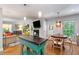 Open living space with a fireplace, dining area, hardwood flooring, and lots of windows at 3176 Gablewood Ct, Decatur, GA 30033