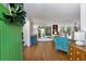 Inviting entryway leading into a bright living room with hardwood floors and a statement green door at 3176 Gablewood Ct, Decatur, GA 30033