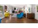 Open-concept living space featuring hardwood floors, colorful decor, and ample natural light at 3176 Gablewood Ct, Decatur, GA 30033