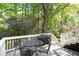 Outdoor patio features a white railing, a table and chairs, and a grill, perfect for entertaining at 3176 Gablewood Ct, Decatur, GA 30033