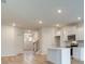 Bright, open-concept kitchen features a central island with white cabinets and modern appliances at 324 Tulip Dr, Covington, GA 30016