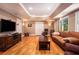 Spacious basement featuring a large TV, seating, and plenty of storage at 3845 Winters Hill Dr, Atlanta, GA 30360