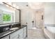 Bright bathroom features a granite countertop, large mirror, and modern finishes at 3845 Winters Hill Dr, Atlanta, GA 30360