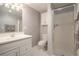 Clean bathroom with a glass shower door, and a white vanity with lots of storage at 3845 Winters Hill Dr, Atlanta, GA 30360