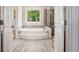Well-lit bathroom with a soaking tub and walk-in shower at 3845 Winters Hill Dr, Atlanta, GA 30360