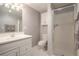 Bathroom features neutral color palette, glass-enclosed shower and modern fixtures at 3845 Winters Hill Dr, Atlanta, GA 30360