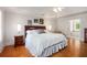 Spacious bedroom boasts tray ceiling, natural light, hardwood floors and neutral tones at 3845 Winters Hill Dr, Atlanta, GA 30360