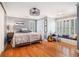 Cozy bedroom with hardwood floors, a window seat, and a unique ceiling fan at 3845 Winters Hill Dr, Atlanta, GA 30360