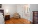 Bedroom featuring hardwood floors, neutral tones and access to the en-suite bathroom at 3845 Winters Hill Dr, Atlanta, GA 30360