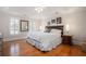 Spacious bedroom boasts tray ceiling, natural light, hardwood floors and neutral tones at 3845 Winters Hill Dr, Atlanta, GA 30360