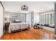 Spacious bedroom with hardwood floors, shuttered windows, and a cozy window bench at 3845 Winters Hill Dr, Atlanta, GA 30360