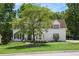 Stately home with lush lawn and mature tree providing ample shade on a sunny day at 3845 Winters Hill Dr, Atlanta, GA 30360