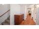 Hallway with hardwood floors, staircase, and access to other living spaces at 3845 Winters Hill Dr, Atlanta, GA 30360