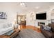 Cozy living room with hardwood floors, fireplace, built-in shelving, and comfortable seating at 3845 Winters Hill Dr, Atlanta, GA 30360