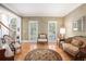 Cozy living room with hardwood floors, decorative rug, and elegant furniture, creating a comfortable and inviting atmosphere at 3845 Winters Hill Dr, Atlanta, GA 30360