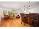 Living room with bar area, hardwood floors, and large windows at 3845 Winters Hill Dr, Atlanta, GA 30360