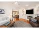 Bright living room with a fireplace, hardwood floors, and stylish decor, perfect for relaxation and gatherings at 3845 Winters Hill Dr, Atlanta, GA 30360