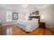 Spacious main bedroom with hardwood floors, sitting area, and tray ceilings at 3845 Winters Hill Dr, Atlanta, GA 30360