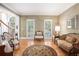 Inviting sitting room with hardwood floors, decorative rug and views of the entry foyer at 3845 Winters Hill Dr, Atlanta, GA 30360