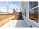 A patio view of the home's backyard, showing the siding, fence, and landscaping at 405 Carrera Ln, Acworth, GA 30102