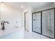 Bathroom featuring a sleek vanity, walk-in shower with black framed glass at 405 Carrera Ln, Acworth, GA 30102